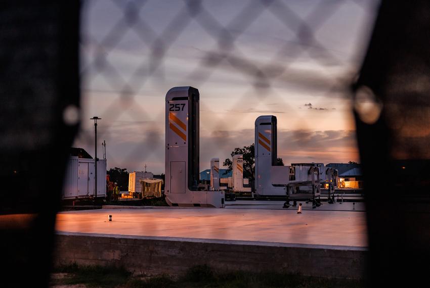 Large 3D-printers sit in a row in a construction zone in the Wolf Ranch neighborhood of Georgetown, Texas on Oct. 4, 2023. The Lennar Wolf Ranch development is the largest collection of 3D-printed homes worldwide.